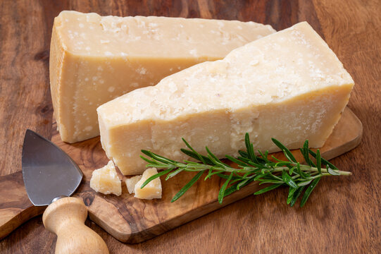 Traditional italian food, 36 months aged in caves Italian parmesan hard cheese from Parmigiano-Reggiano and grana padano from Po river valley, Italy
