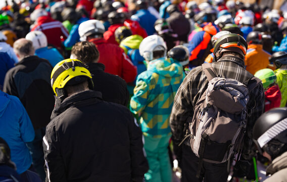 Large Crowd of Skiers and Snowboarders Waiting in Line