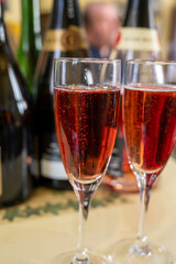 Pouring and tasting of rose or pink cuvee sparkling wine brut, grang reserve, champagne in Ay-Champagne wine making village in Vallee de la Marne, , Champagne region, France