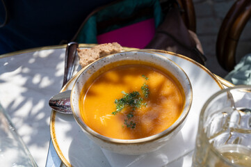 Spicy carrot soup with harissa made from hot chili pepper, lemon, garlic, coriander