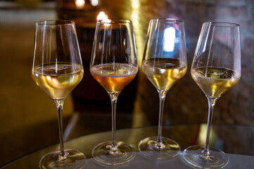 Visit of wine cellar, tasting of brut champagne sparkling wine produced by traditional method in underground caves close up