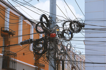 Messy electrical wiring on a power pole 