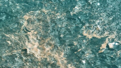 An aerial view shows the ocean's surface littered with plastic waste, illustrating the growing environmental crisis that threatens marine life and habitats.
