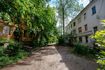 Old overgrown house in ghost town
