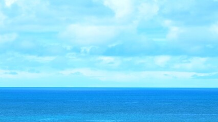 Fototapeta premium Capturing the tropical sea from above, the drone showcases the smooth waves and vibrant blue water, evoking a sense of tranquility and connection with nature. Thailand. 