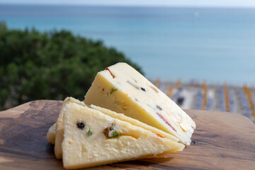 Italian provolone cheese made with fresh rocket salad, black pepper, olives, wine, Sicilian cheese,...