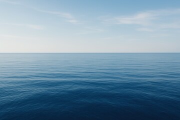 Fototapeta premium Tranquil and serene expanse of calm deep blue ocean water stretching to the horizon under a clear sky creating a minimalist and peaceful natural background.