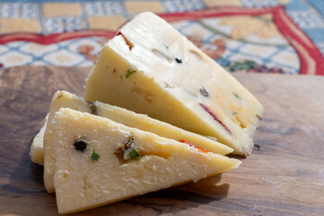 Italian provolone cheese made with fresh rocket salad, black pepper, olives, wine, Sicilian cheese,...