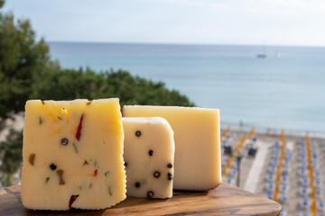 Italian provolone cheese made with fresh rocket salad, black pepper, olives, wine, Sicilian cheese,...