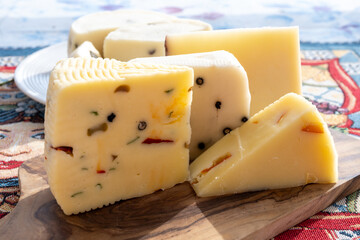 Italian provolone cheese made with fresh rocket salad, black pepper, olives, wine, Sicilian cheese,...
