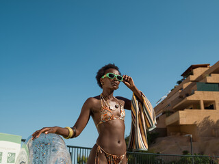 Fashionable woman portrait against blue sky
