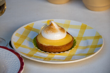 One piece of lemon tart with white eggs meringue from French pastry shop