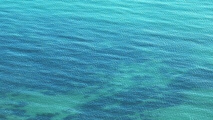 A captivating drone perspective of the tropical sea, where the soft blue tones and gentle waves...