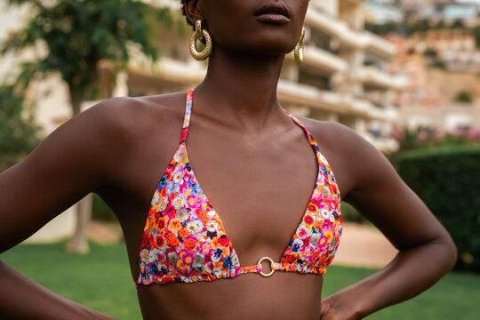 Woman wearing stylish floral swimsuit bra