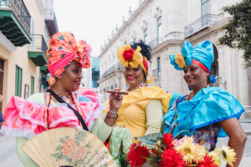 Cuban women called canasteras with habano flowers and typical costume in La Havana, Afro caribbean...