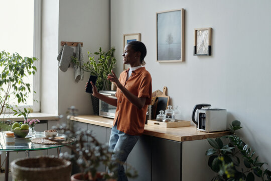 Black Woman Dancing during Home Breakfast