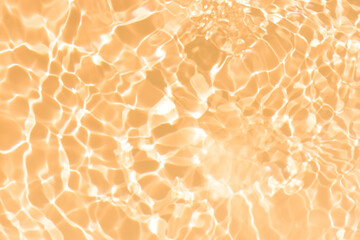 Abstract orange background with waves. Pink water bubbles on the surface ripples. Blurred...