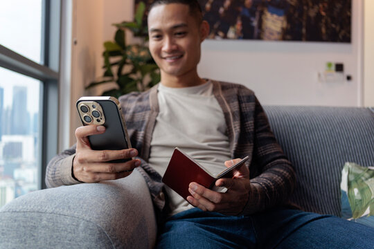 Young man entering passport information