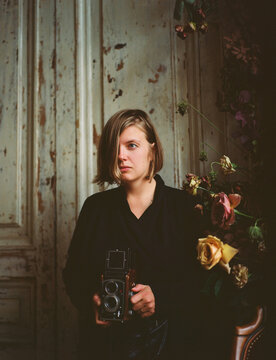 Woman taking photo on medium format camera