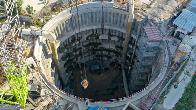 Deep Construction Site Showing Heavy Equipment and Excavation Details