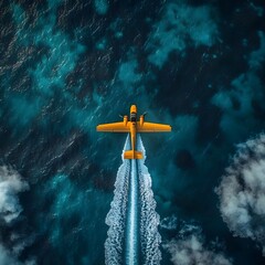 Aerial View of a Yellow Airplane Flying Over Deep Blue Ocean Water Leaving a Wake