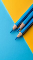 Vibrant Blue Pencils on a Bold Yellow and Blue Background Perfect for Creative Projects
