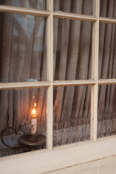 Vintage candle in the window