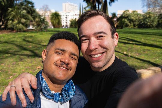 Happy gay couple taking a selfie
