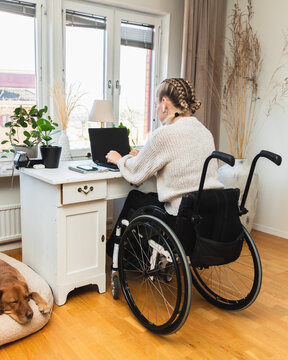 Accessible Home Office: Woman Working in Wheelchair