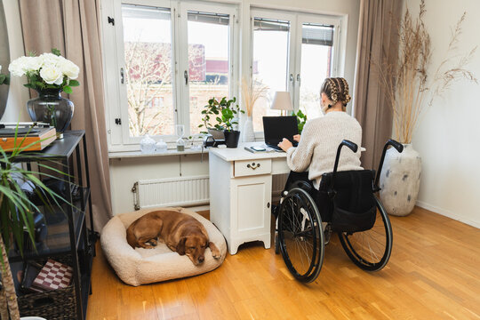 Accessible Home Office: Woman Working in Wheelchair