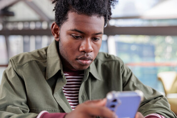 Young man absorbed in social media