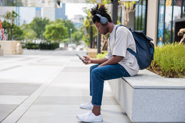 Young man checking social media while waiting