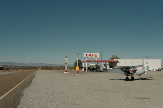 airplane parked outside vintage cafe on route 66 in california 