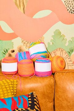 Brightly colored neon yarn ontop of couch