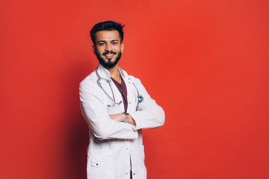 Portrait of Indian doctor in studio.