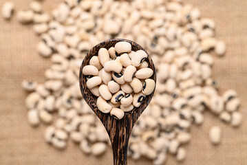 Black-eyed pea or cowpea in wooden spoon, Food ingredient, Top view