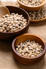 Black-eyed pea or cowpea in wooden bowl with scoop, Food ingredient