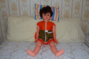Old Doll on Bed in Family Home