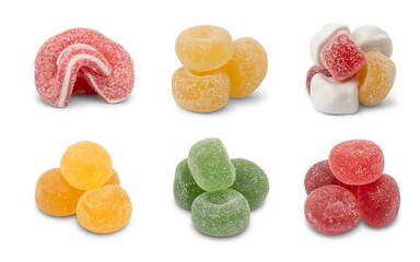A display of assorted gummy candies in various colors and shapes on a white background