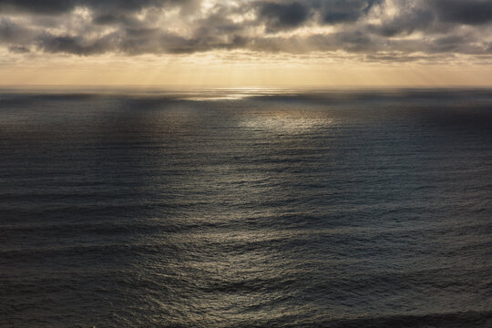 Vast ocean and clearing storm clouds at dusk