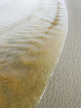 Intertidal stream on beach