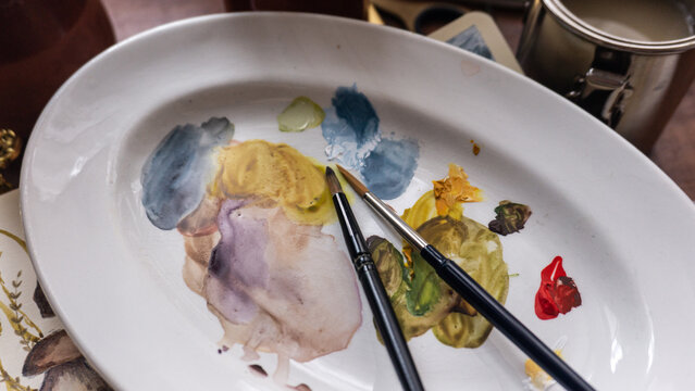 Watercolor Palette with Brushes in an Artistic Setup