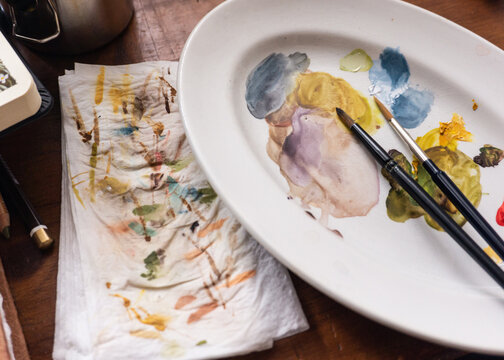 Messy Watercolor Palette with Art Brushes