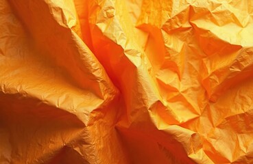 Crumpled orange paper texture. Wrinkled abstract background with multiple creases, folds. Empty space for copy. Perfect for backgrounds, posters, banners or design templates.