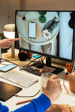 Reviewing photo on desktop screen



