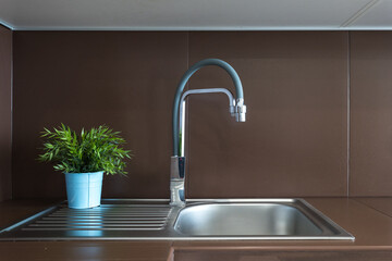 kitchen faucet on a stylish metal sink