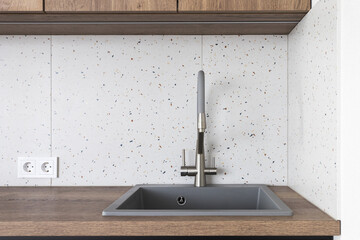 kitchen faucet on a stylish metal sink