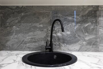 kitchen faucet on a stylish metal sink