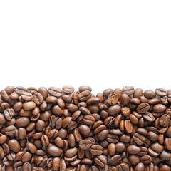 Many roasted coffee beans on white background. Coffee beans border with area for copy space. Close up images.