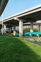 Concrete structure and asphalt road space under the overpass in the city